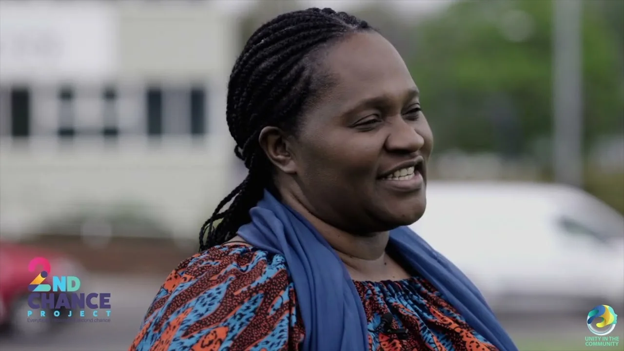 Faith speaking during a community development project.